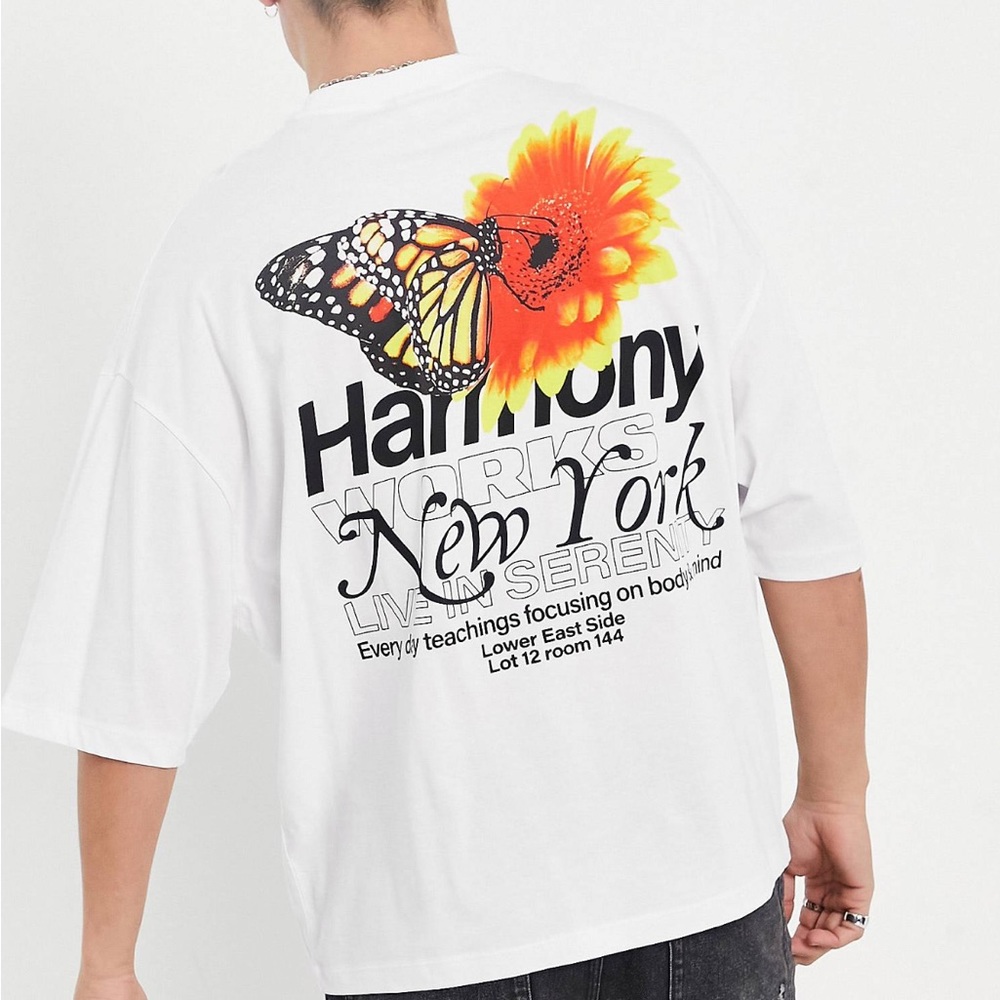Unique design oversize graphic t-shirt. White with butterfly and black print